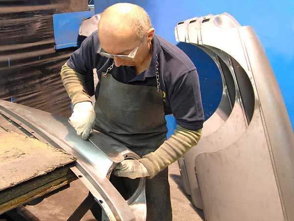 An Artisan Finesses an MGB Headlight Bucket