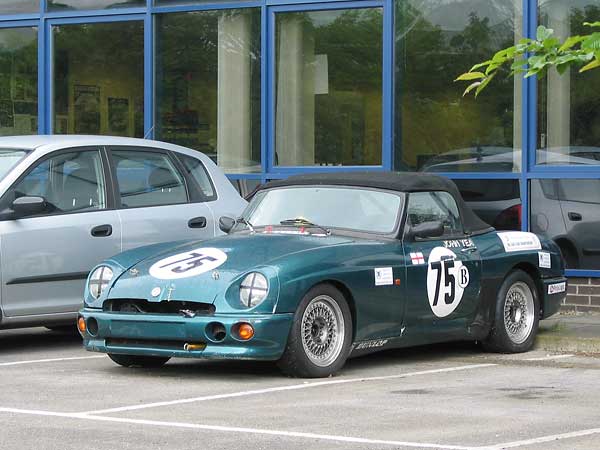 Managing Director John Yea's MG RV8 race car parked outside British Motor