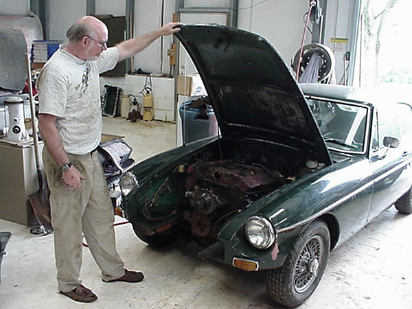 Steve DeGroat reviews a trial installation of the big block Buick engine.