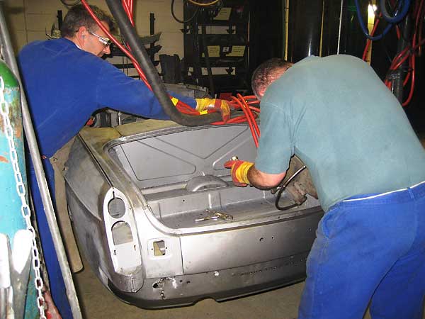 Spot welding the rear body panels together.