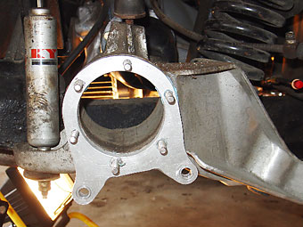 install the brake brackets onto the swing arm