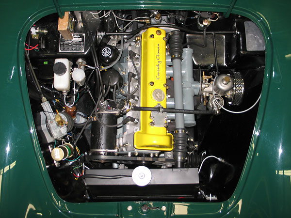 Lotus Elan, with its Coventry Climax engine. (What's up with that intake manifold? Eeeek.)
