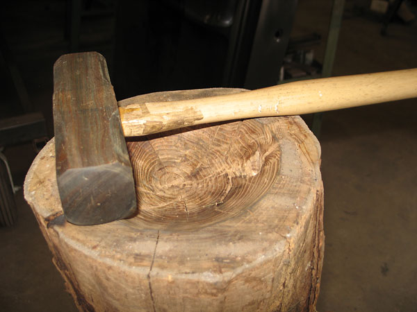 The opposite end of the hammer head is contoured to match this bowl's radius.