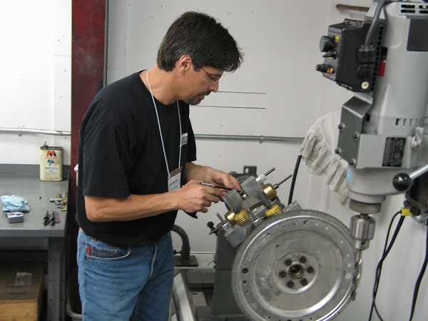 Oiling a journal under a weight assembly. The weights remain in vertical alignment while the crankshaft turns.