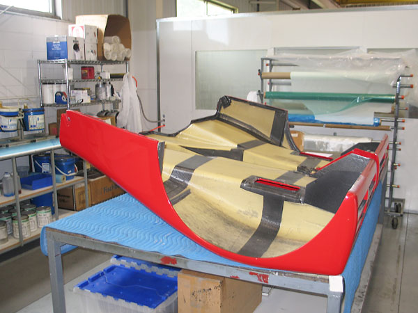Restoring body panels of a Ferrari 333SP racecar.