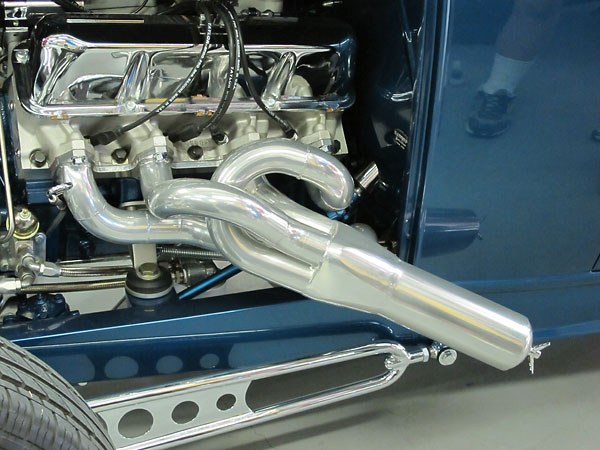 Headers with removable plugs and with exhaust flow diverted through hidden mufflers.