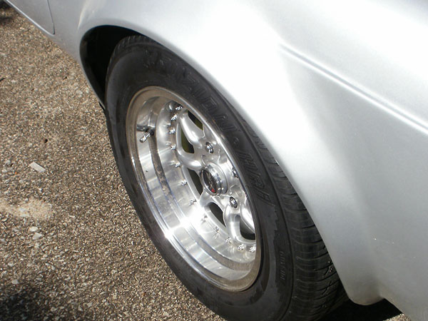 Unlike the front, the rear fender flares cross the horizontal feature line.