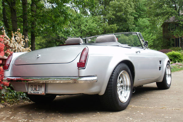 Nissan Stanza donor parts give this MGB a distinctive wrap-around fender flare appearance.