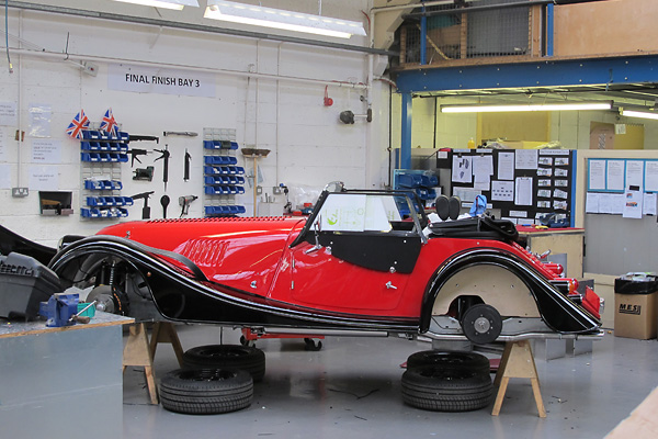 A rubber trim strip separates fenders from other bodywork.