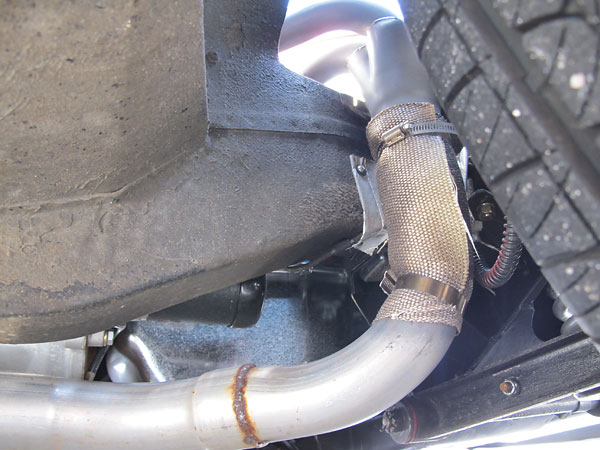 Mantell Motorsport RV8 style (through-the-fender) four-into-one exhaust headers.