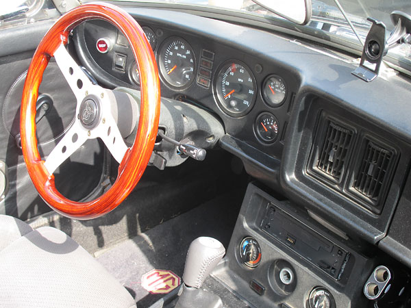 Grant wood-rim steering wheel installed on a Grant adapter.