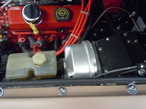 Stock late-model MGB brake booster and master cylinder.