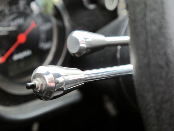 The pushbutton at the end of the turn signal stalk is the high beam switch.