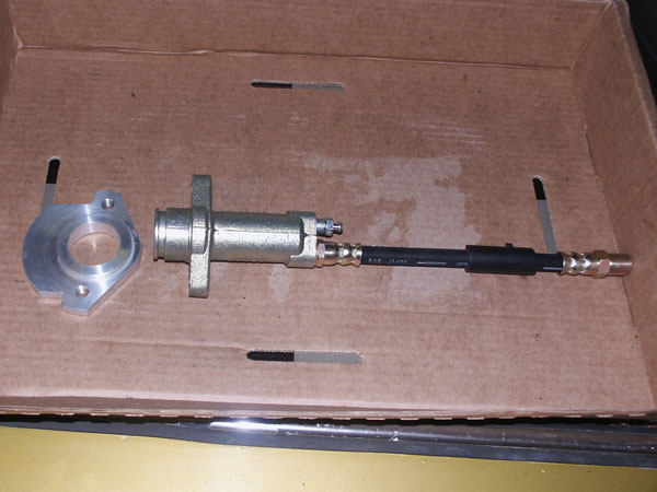 TR6 clutch slave with MGB hose and custom alloy bracket to adapt to T5 transmission