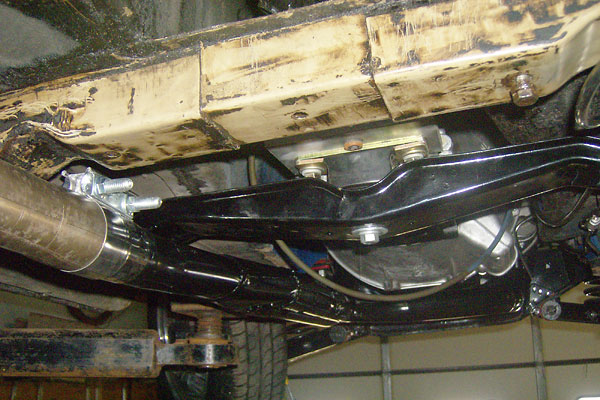 Custom LT77 transmission mount on a modified MGB crossmember, mounted in the stock location.