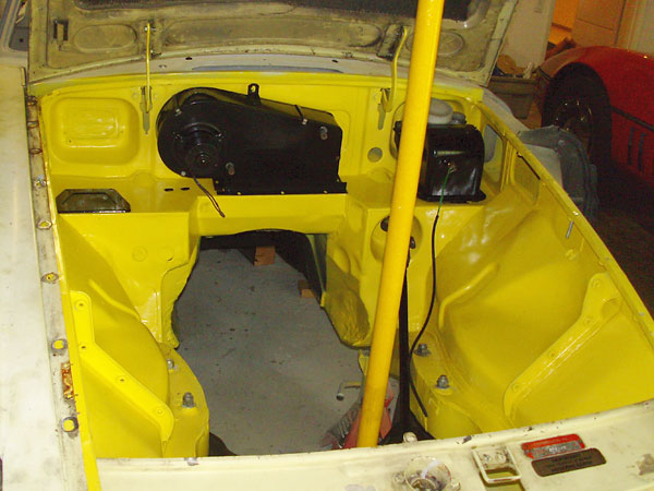 Engine compartment painted and reshaped for the V6.