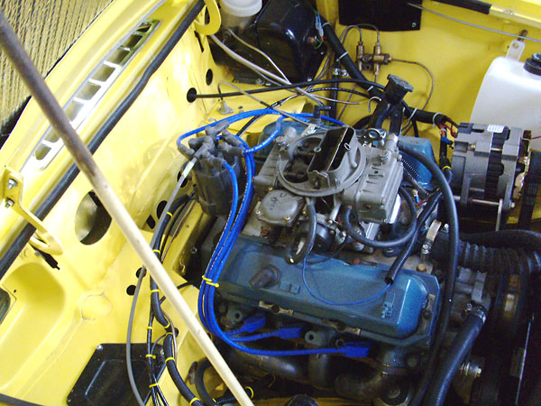 Holley 8007 390cfm carburetor on a modified Edelbrock intake manifold.