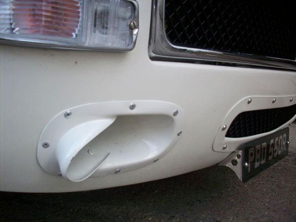 Modified Sebring front valance (recessed and blended into front panel) with modified brake ducts.
