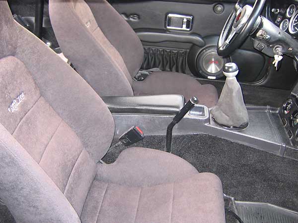 custom interior with fiberglass speaker pods, arm rests, and door panels with map pockets