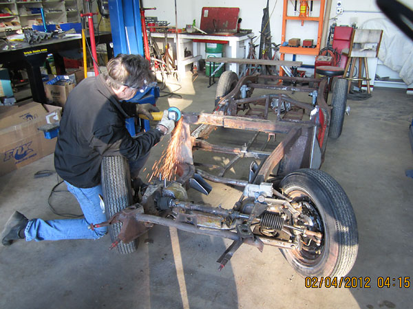 Removing the passenger side goalpost brace for exhaust clearance.