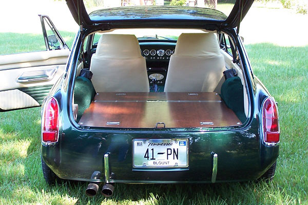 Cherry wood cargo floor is hinged in the middle