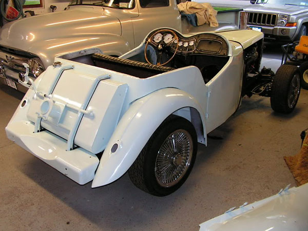 MG TD fuel tank and spare tire carrier.