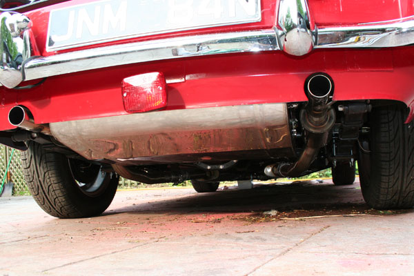 Stainless fuel tank, centrally positioned to accomodate dual tailpipes.