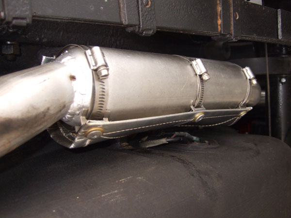 A heat shield for the fuel tank and fuel level sender connections.