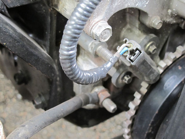 Crank position sensor and trigger wheel are original Ford parts.