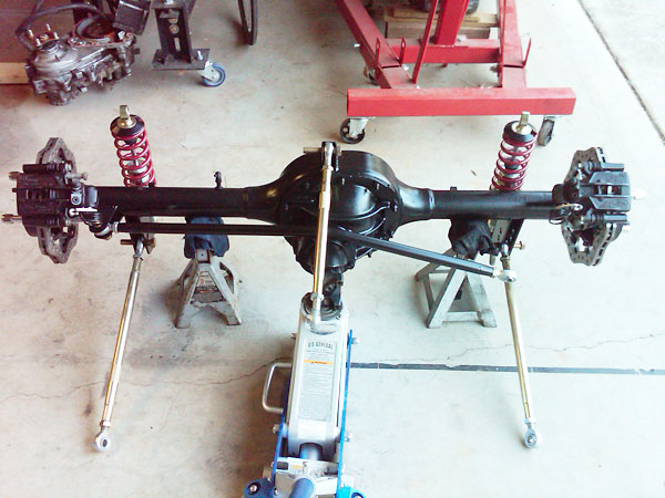 Ford 8 inch rear axle with 3-link suspension components and Wilwood disc brake kit.
