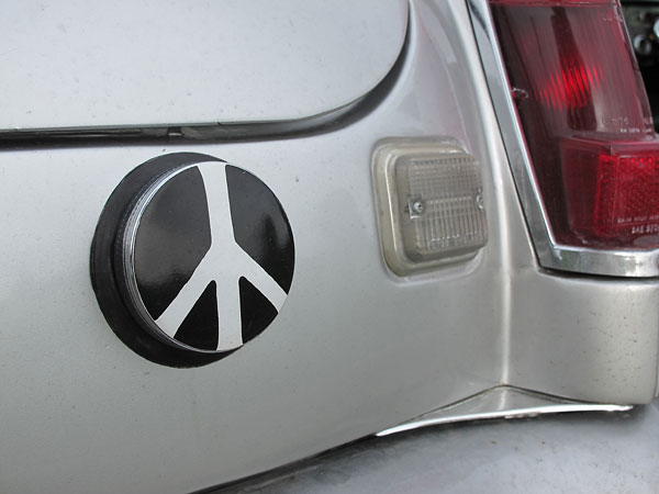 Peace symbol decal on fuel cap.