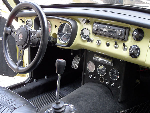 Stock steel dashboard, stripped and repainted primrose yellow.