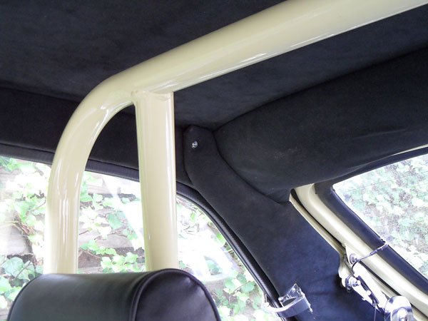 Everything is upholstered in black Alcantara, including the ceiling trim panel.
