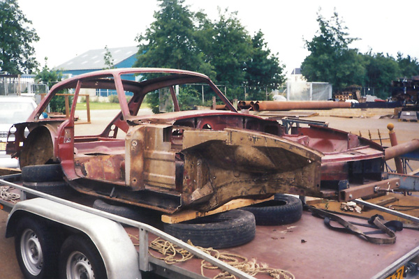 A very rusty MGB GT bodyshell.