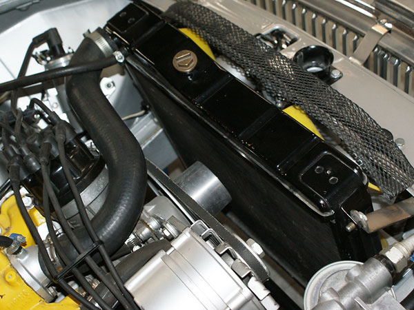 Stock MGB GT V8 radiator and dual electric fans.
