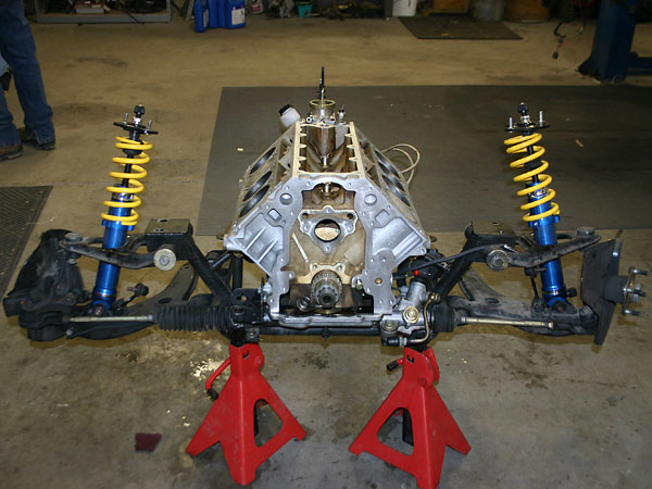 Miata suspension, wrapped around a bare engine block.