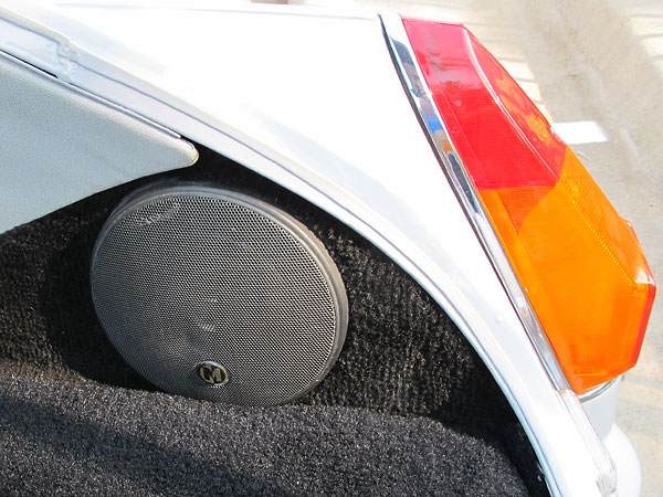Closed in rear fender cubbies with carpet covered metal inserts, with speakers installed.