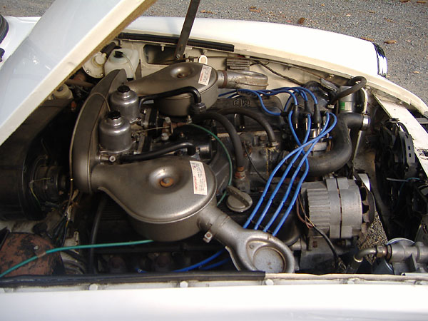 twin SU HIF6 carbs mounted on a manifold adapter