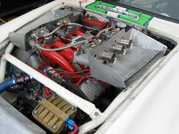 The manifolds are fed by four Weber 48DCOE two-barrel, side-draft carburetors.