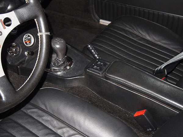 Universal power window kit, with switches installed in center console.