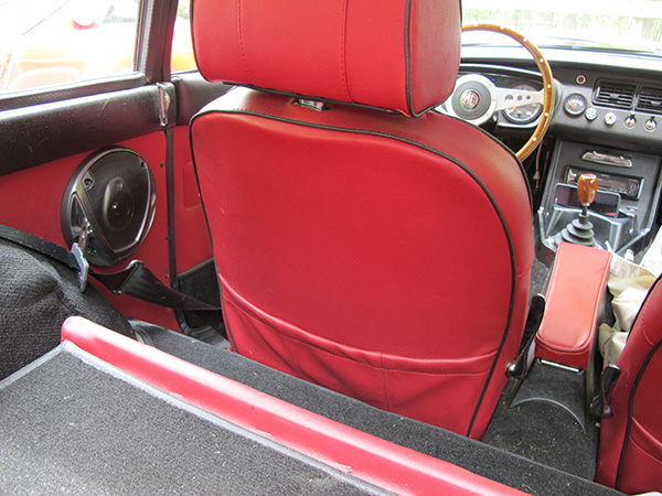 Prestige Auto Trim seat upholstery with map pockets. Leather covered aftermarket armrest.