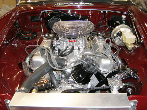Buick four barrel intake manifold. Edelbrock 1405 500cfm carburetor, with electric choke.