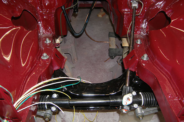Holes added to the inner fenders accomodate MG RV8-style headers.