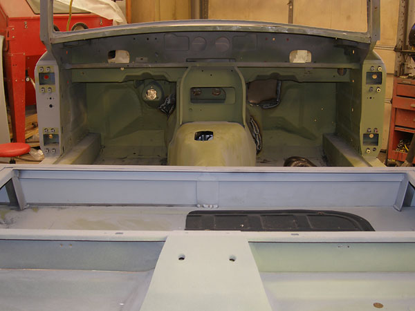A storage cubby added over the battery bin, where MG provided a rear seat.