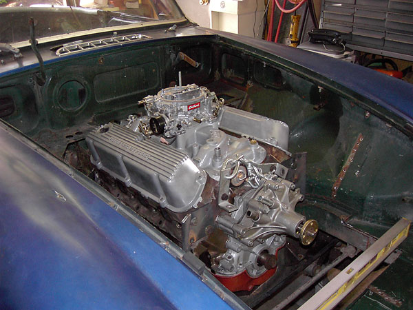 With the intake manifold and carburetor in place, clearance to the bonnet may be verified.