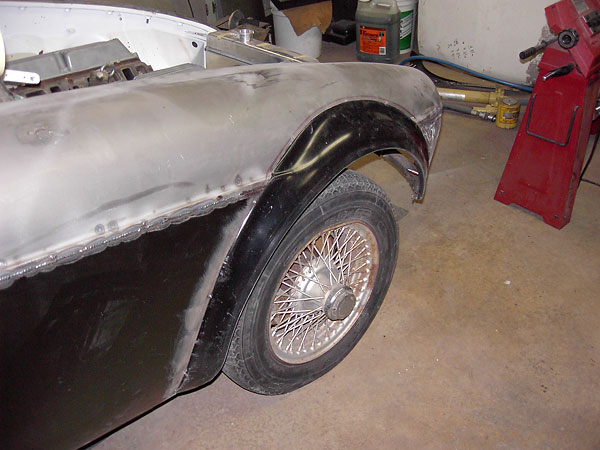Fiberglass flares bonded on with Fusor adhesive from LORD Corporation.