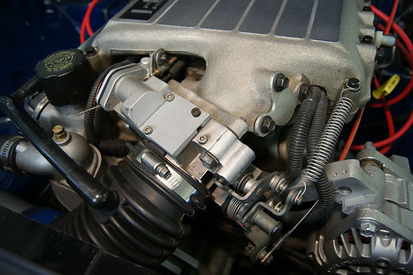 The accelerator pedal is connected via cable to this side of the throttle body.