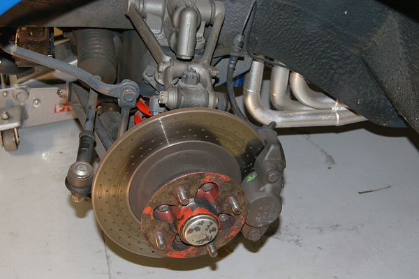 Stock MGB front brakes, upgraded with EBC Green Stuff pads and cross-drilled rotors.