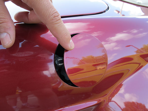Hagan recessed/lidded fuel filler is held shut by a magnetic catch.
