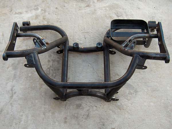 Revised rear suspension subframe with double-shear shock absorber mounts.